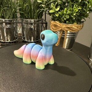 Example of a 3D printed rainbow brachiosaurus.