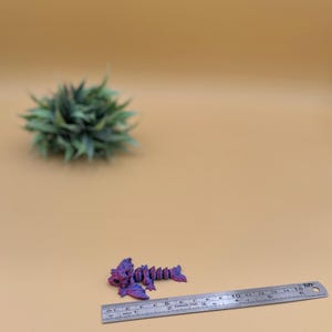 3D printed wyvern dragon toys are about 2.5 inches long.