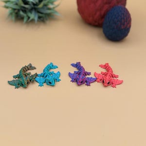 A variety of 3D printed baby wyvern dragons.