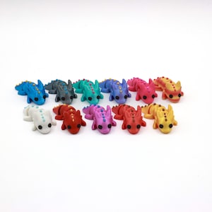 Mini dragon toys come in metallic and non-metallic shades.