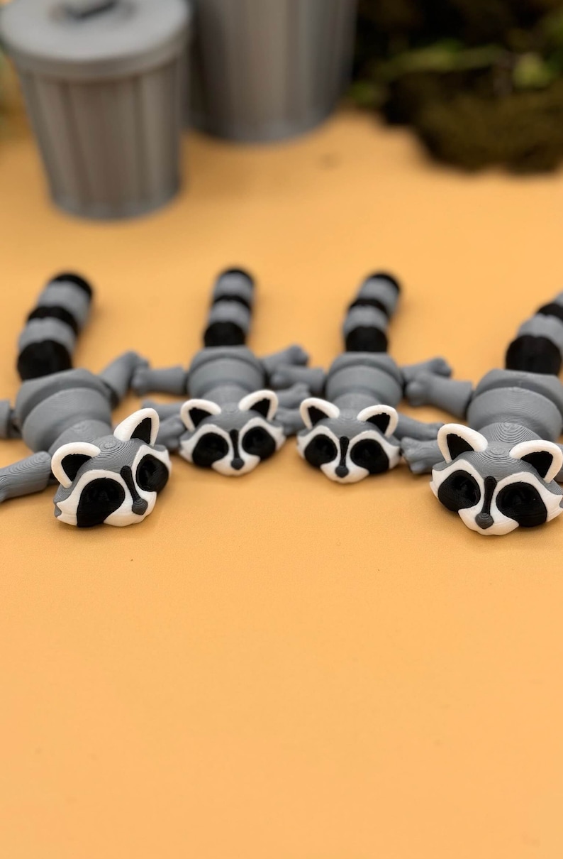 Adult3D printed raccoon toys.