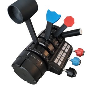 May include: A black flight simulator throttle quadrant with multiple levers and buttons. The levers have blue and red accents. The throttle has a large black handle and several dials and switches. The device is designed for flight simulation.