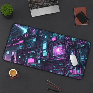 May include: A rectangular computer mouse pad with a futuristic, neon-lit circuit board design in shades of pink, blue, and purple. A white mouse rests on the pad, alongside a laptop, a small potted plant, and office supplies.