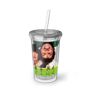 May include: Clear plastic tumbler with a lid and straw. The tumbler features a movie image of two people and a green and yellow band with cartoon figures. The tumbler is designed for cold drinks.