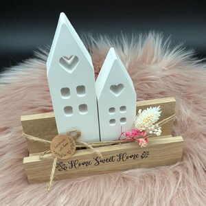 Home sweet Home: House set made of Raysin on a wooden block base