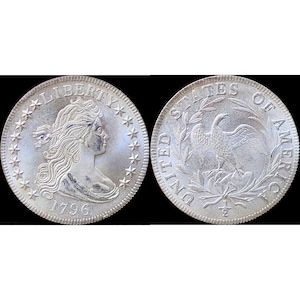 May include: A silver 1796 United States half dollar coin. The obverse features a bust of Liberty facing right with the inscription "LIBERTY" and "1796". The reverse features a bald eagle perched on a branch with the inscription "UNITED STATES OF AMERICA".