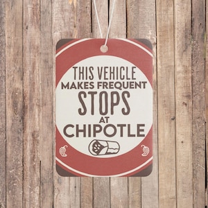 May include: Red and white car air freshener with the text "This vehicle makes frequent stops at Chipotle" and a burrito illustration.