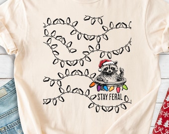 Comfort Colors® Stay Feral Christmas Shirt, Raccoon Christmas Shirt, Christmas Light Tee, Sarcastic Funny Shirt, Holiday Party Accessory