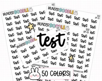 May include: Three white sticker sheets featuring the repeating black cursive text test, the brand name WUNDERDOODLE with a small rabbit icon, and a large central die-cut sticker reading test. A pink rectangular label at the bottom reads 50 COLORS!