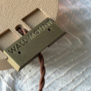 Wall mount for the sconce set in the open position