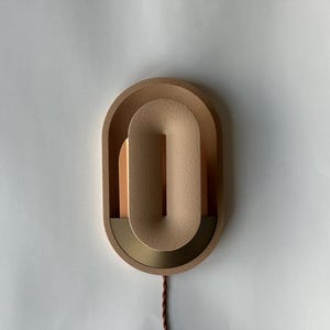 Plug in wall sconce turned off.