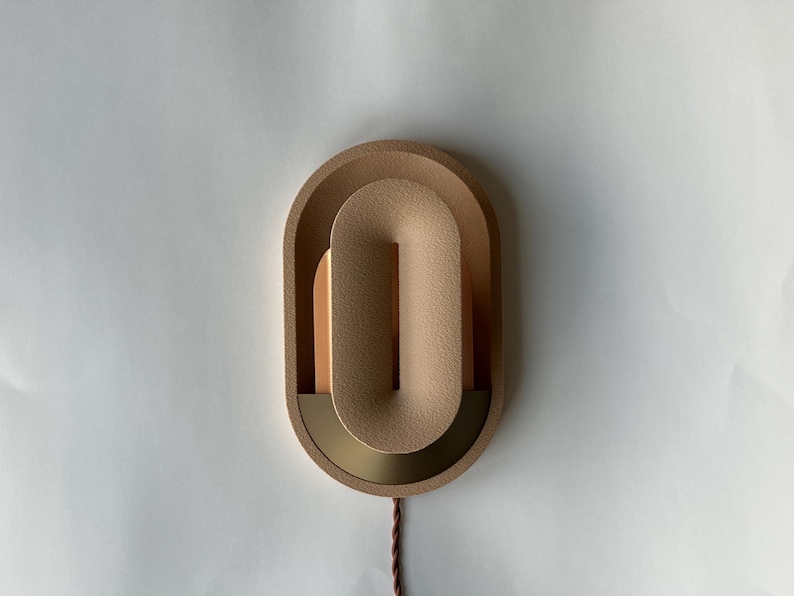 Plug in wall sconce turned off.