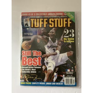 May include: A Tuff Stuff magazine cover featuring Michael Jordan. The cover has the text "Still The Best" and "23 MJ Items To Get Now". The magazine is sealed in plastic.