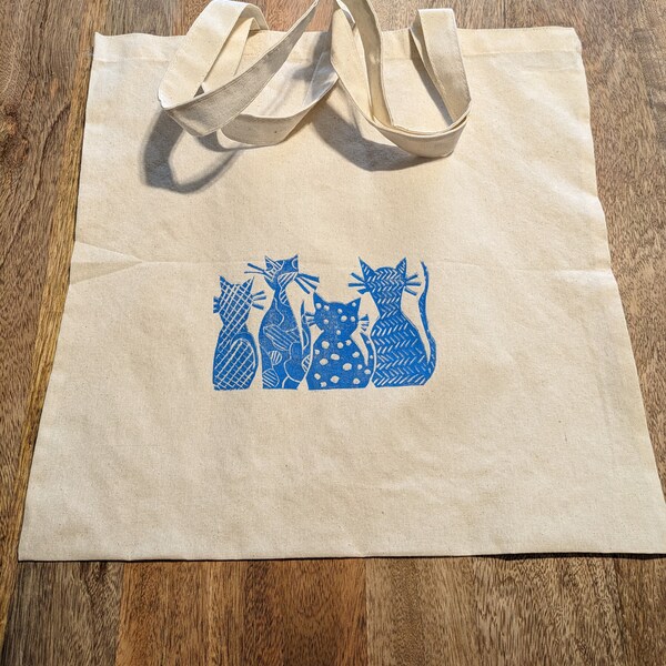 Cute canvas tote bag with hand-carved blue cats stamped on front