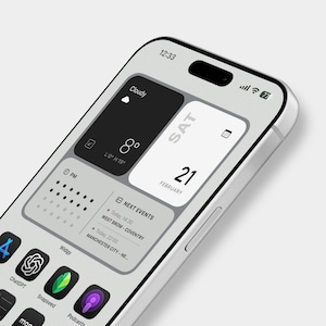 May include: A smartphone screen showing a custom home screen with the time, weather, date, and app icons. The weather shows 8 degrees. The phone has a silver frame and a sleek design. The date is the 21st of February.