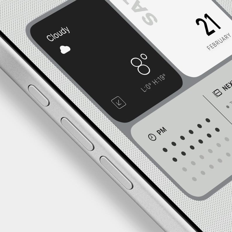 May include: A smartphone screen showing a digital interface with weather details, temperature, and date. The display reads "Cloudy", 8 degrees, and February 21. The phone has silver buttons on the side. The temperature is displayed in degrees Celsius.