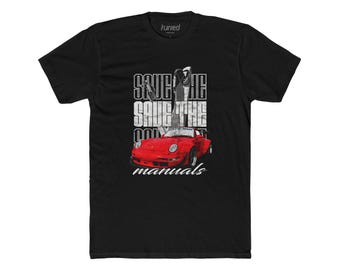 May include: Black t-shirt featuring a red sports car graphic with the text "SAVE THE MANUALS". The shirt has a crew neck and short sleeves. The brand name "tuned" is printed on the top.