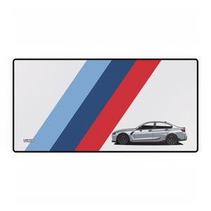 May include: A rectangular mousepad with a white background and a diagonal design in light blue, dark blue, and red. A silver car is on the right side. The word "TUNED" is in the lower left corner.