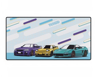 May include: A blue, yellow, and teal car mousepad with a white background and the word "TUNED" in blue. The mousepad features three cartoon cars: a purple Nissan Skyline GT-R, a yellow Mazda RX-7, and a teal Honda NSX.