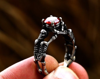 Stainless Steel Gothic Skull Ring with Red Gemstone - Dark Engagement/Promise Ring, Skeleton Hand Design, Love to Death Jewelry