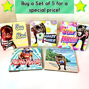 May include: A set of five square decorative items featuring pug dogs with various designs. One says "Bee Kind", another "Donut Worry", and a third "Stay Pawsitive". The others say "PAW's Hive Vibes Only" and "Always Make Time to Play".