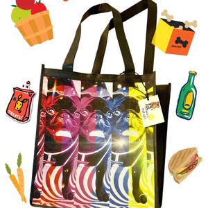 May include: A black reusable tote bag with a colorful pop art design of a pug dog. The bag has two black handles and a white tag that says "PUG ART." The bag is surrounded by various cartoon images of food, snacks, and other items.