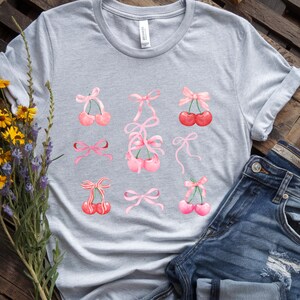 Coquette Cherries and Bows Graphic Tee Shirt, Soft Girl Aesthetic, Trendy Pink Fruit Top, Pastel Y2K T-Shirt, Unisex Jersey Short Sleeve Tee