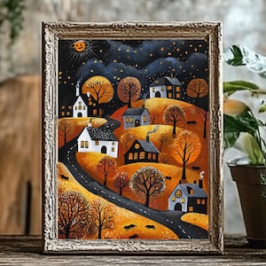 May include: Framed folk art painting of a Halloween village scene. The artwork depicts houses with lit windows, a winding road, and bare trees under a starry night sky with a jack-o'-lantern moon. The color palette includes black, orange, and white.