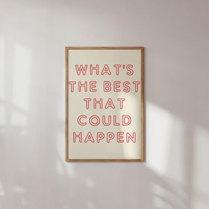 以下が含まれることがあります： 白い背景に赤い文字で「WHAT'S THE BEST THAT COULD HAPPEN」と書かれた額装されたプリントです。