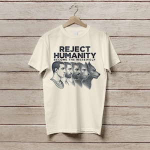 May include: A cream-coloured t-shirt with the text "Reject Humanity Become the Werewolf" and a graphic of four figures transforming into a werewolf.