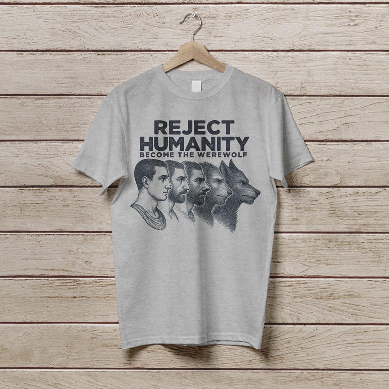 May include: A grey t-shirt with the text "Reject Humanity Become the Werewolf" and a graphic of a man transforming into a werewolf.