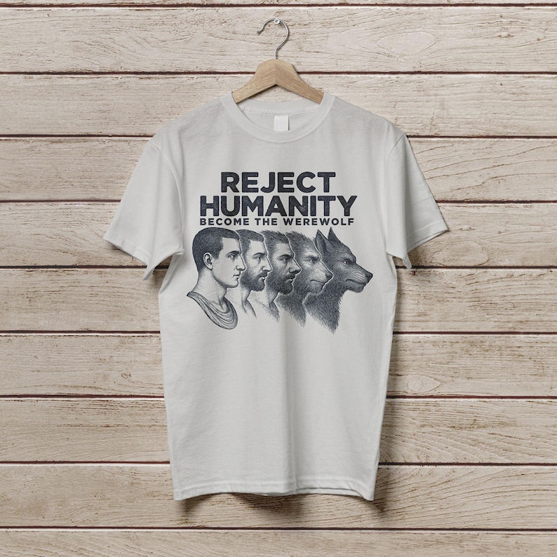 May include: White t-shirt with a black graphic print that says "Reject Humanity Become the Werewolf". The graphic features a series of four images, starting with a human face and transitioning to a wolf face.