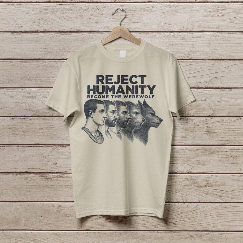 May include: A beige t-shirt featuring a graphic print of four men transforming into a werewolf. The text on the shirt reads "Reject Humanity Become the Werewolf".