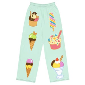 May include: Light mint green lounge trousers featuring a repeating pattern of various ice cream treats, including cones, popsicles, and sundaes in vibrant colours like pink, yellow, brown, and blue, with a simple elasticated waistband.
