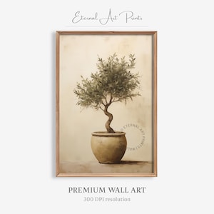 Op de afbeelding: Een ingelijste print van een olijfboom in een pot. De boom heeft een gedraaide stam en groene bladeren, tegen een neutrale achtergrond. De print is gemarkeerd met "Eternal Art Prints" en "Premium Wall Art".