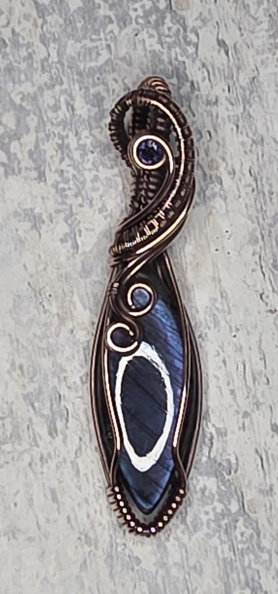 Hand Woven Copper Purple Labradorite Pendant accented with an Iolite.