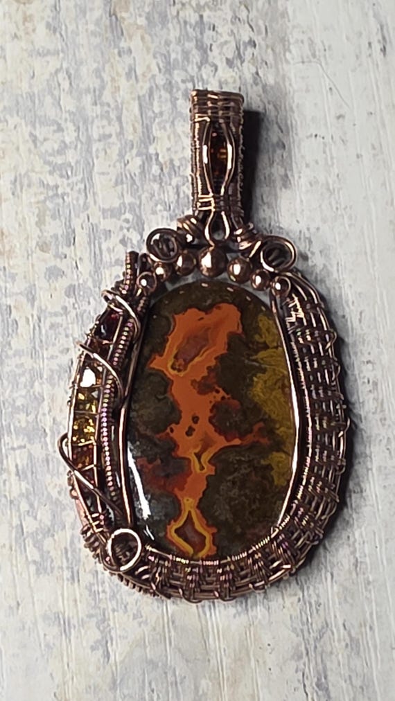 Moroccan Seam Agate wrapped in copper.