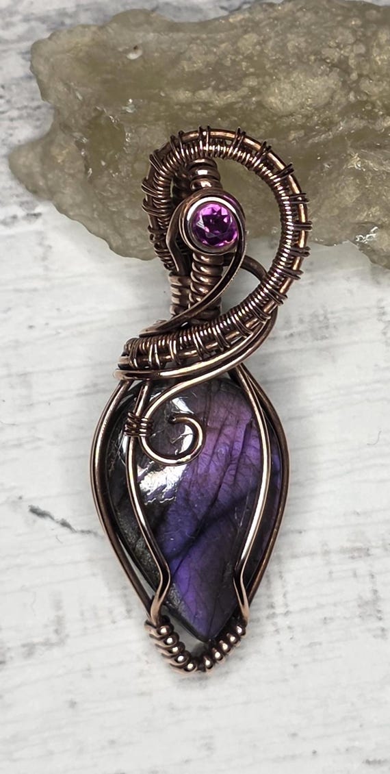 Hand Woven Copper Purple Labradorite Pendant with Raspberry Garnet Accent.