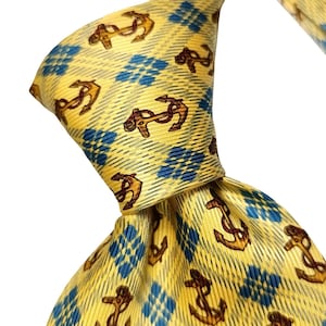 May include: Yellow necktie with a repeating pattern of brown anchors and blue diamond shapes. The tie is knotted, showcasing the fabric's texture and design. A classic accessory for formal or nautical-themed attire.