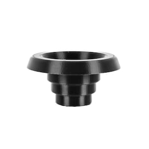 May include: A black bottle stopper with a tiered design. The stopper has a wide, flat top and a series of descending, stepped rings leading to a narrower base. The object is made of a solid, opaque material.