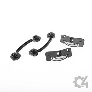 May include: Four black plastic components consisting of two curved handle-like pieces with circular mounting ends and two rectangular bracket pieces featuring central holes and integrated curved slots for mechanical assembly or hardware attachment.