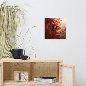 May include: A framed art print depicting a woman in a red dress and a red dragon. The artwork has a fantasy theme with a detailed illustration style. The dragon is behind the woman, with red and orange tones dominating the colour palette.