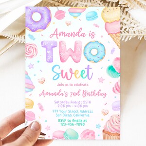 May include: A colorful invitation for a second birthday party with a sweet theme. The invitation features a donut, a cupcake, a lollipop, and other sweet treats. The text on the invitation reads "Amanda is Two Sweet" and includes the date, time, and location of the party. RSVP information is also included.