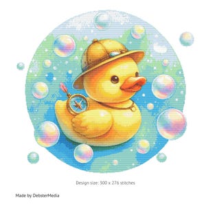 May include: A yellow rubber duck wearing a brown explorer hat and holding a compass, surrounded by colorful bubbles on a blue and green background. Design size: 300 x 276 stitches.