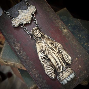 May include: A rustic wooden sign with the text "Welcome to our home" in white lettering. The sign features a distressed finish and a simple, inviting design, perfect for entryway decor.