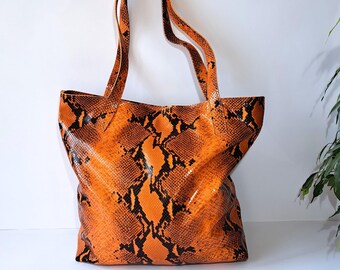 Bolso de hombro de cuero hecho a mano: estampado naranja y negro, bolso acolchado para portátil