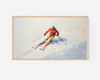 May include: A framed print of a skier in a vibrant orange jacket and yellow pants, gliding down a snowy slope. The artwork features a light wood frame and a dynamic, impressionistic style, capturing the motion of the skier.