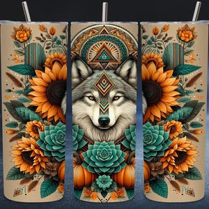 May include: A beige tumbler with a detailed design featuring a wolf, sunflowers, and succulents. The wolf is centered, surrounded by orange sunflowers and teal succulents. The design includes geometric patterns and a straw.
