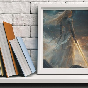 May include: A framed fantasy art print featuring a woman in a white gown holding a glowing sword. The woman has long blonde hair and is standing in a field with a starry sky in the background.