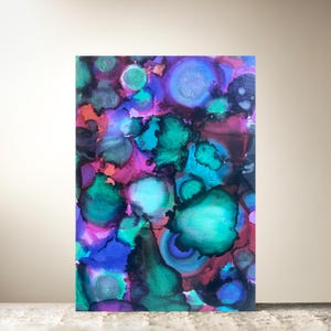 Tres tarjetas con tintas de color